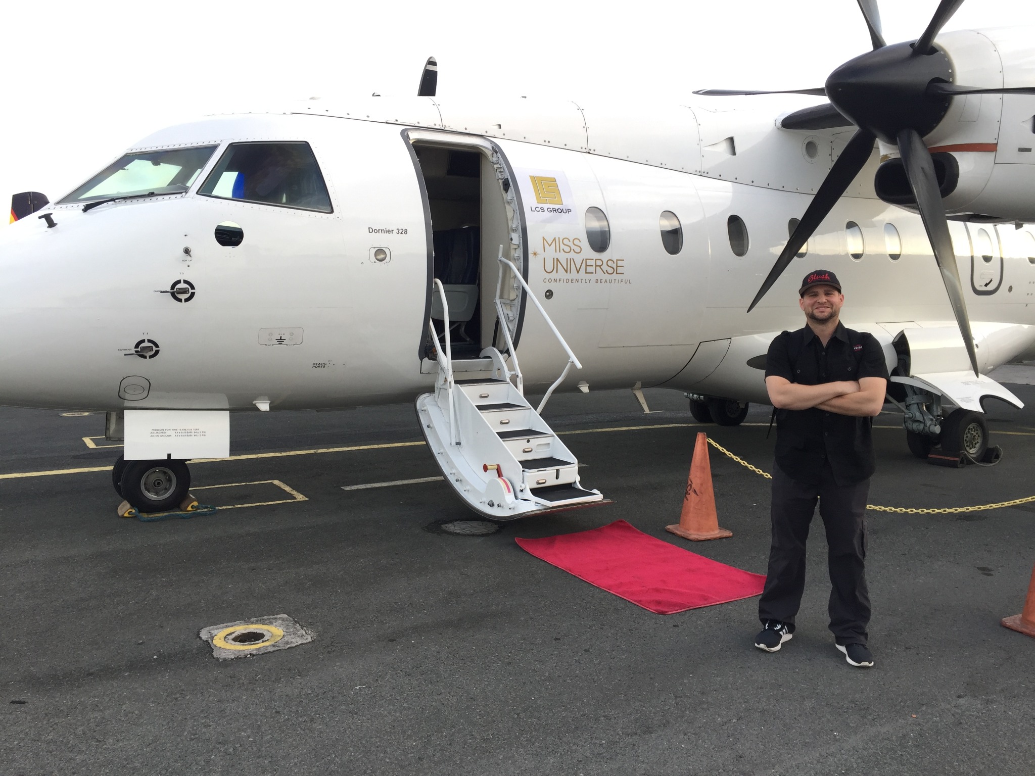 Bryan Schnitzer on location with Miss Universe aircraft